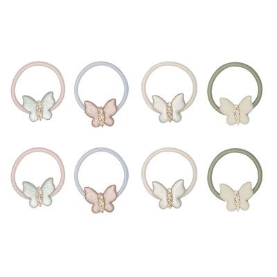 EIght butterfly ponies in soft pastel shades, featuring metallic fabric wings and gold glitter bodies 