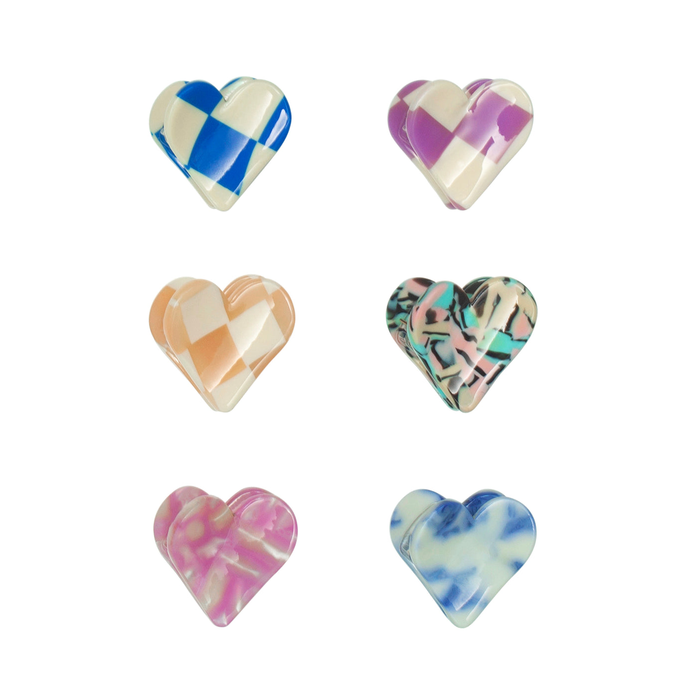 Six mini heart shaped bulldog clips for girls in a vibrant mix of colours and patterns