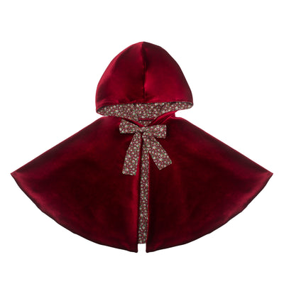 Luxuriously soft deep red velvet cape with hood in the style of red riding hood, complete with ditsy floral print bow and fabric lining