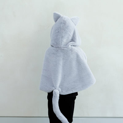 Child wearing fluffy grey cat cape with pink velvet bow and gold glitter ears