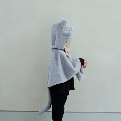 Child wearing fluffy grey cat cape with pink velvet bow and gold glitter ears
