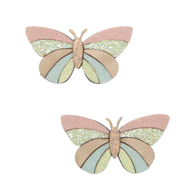 Two intricately crafted pastel coloured and glitter fabric butterfly hair clips