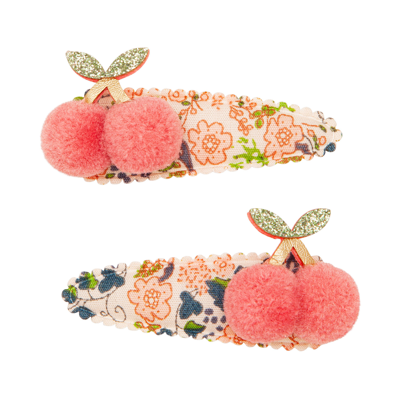 Pair of floral print hair clips featuring a pair of soft pink pom pom cherries with glitter leatherette leaves