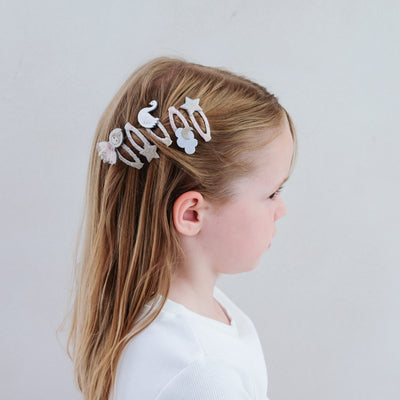 5 pack of pretty ballerina themed hair clips worn to the side
