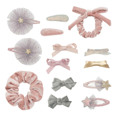 Contents of filled stocking featuring- pink velvet scrunchie with shimmering silver foil pattern- Small pink bow scrunchie-Two grey velvet bow mini clips-Two pleather bow mini clips in gold and shimmering silver-Two fabric bow mini clips in pink-Two purple tulle and pink star clic clacs with glittery gold stars-Two pink shooting star clic clacs in pink and purple with silver and gold glittery stars- Velvet fabric clic clacs in pink and glittery silver 