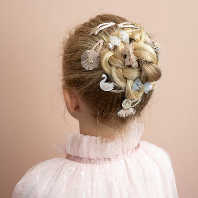 ballerina mini clic clacs bring a sprinkle of glittery magic with charming swan, star, and cloud designs.