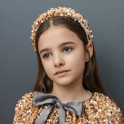 Dark haired girl Velvet and sequin alice band in rose gold and blush