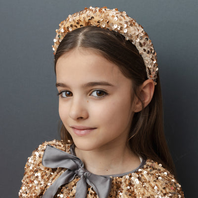 Dark haired girl Velvet and sequin alice band in rose gold and blush