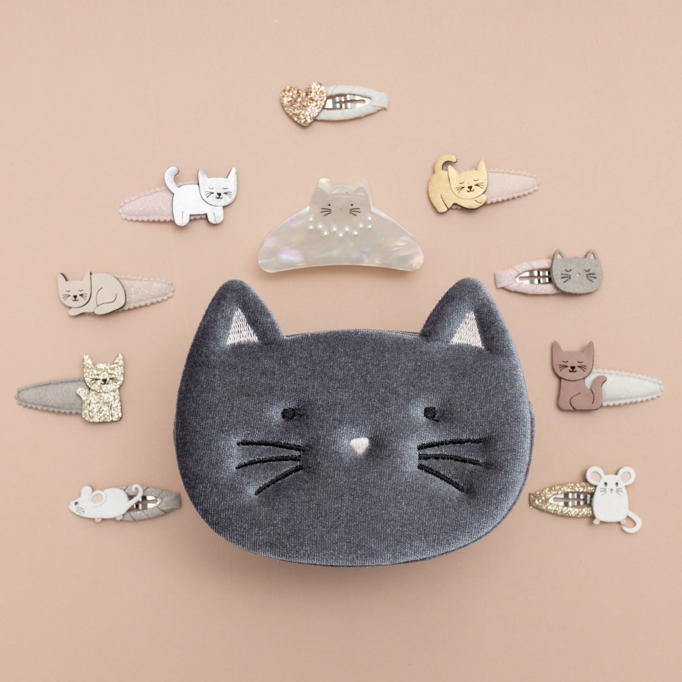 Soft grey velvet kitty cat bag, surrounded by cute cat themed clips
