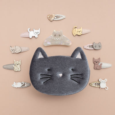 Soft grey velvet kitty cat bag, surrounded by cute cat themed clips