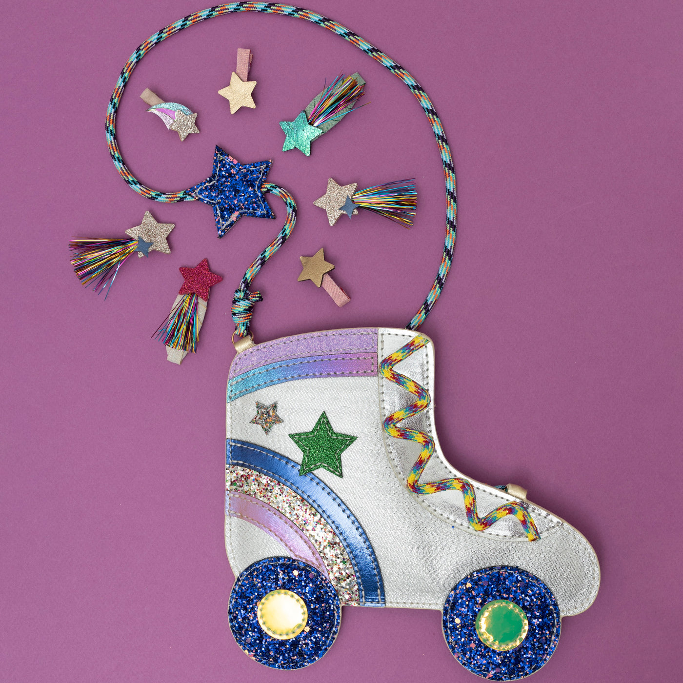 A dazzling glittery roller skate crossbody bag, shimmering with metallic sparkles and retro details like wheels and laces, surrounded by a collection of disco-themed hair clips, creating a fun, party-ready vibe