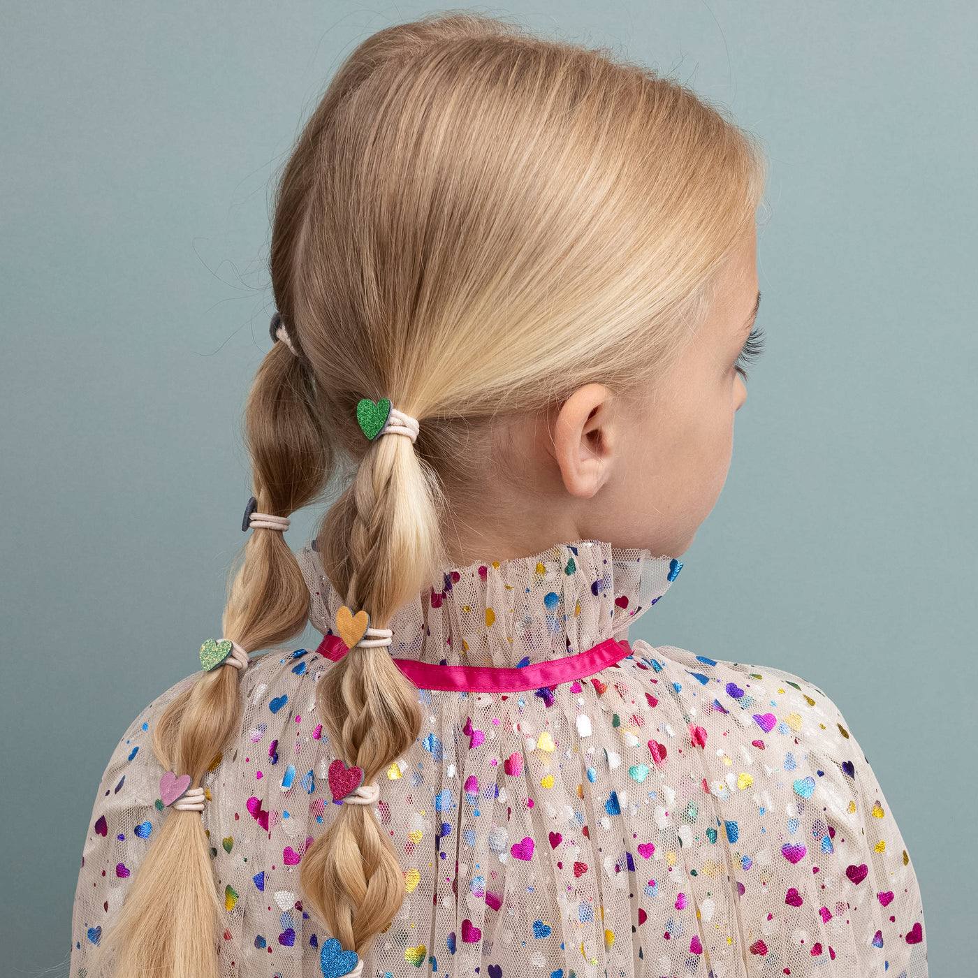 Jazzy heart mini ponies in long blonde hair Featuring colourful hearts crafted from glitter and metallic fabrics
