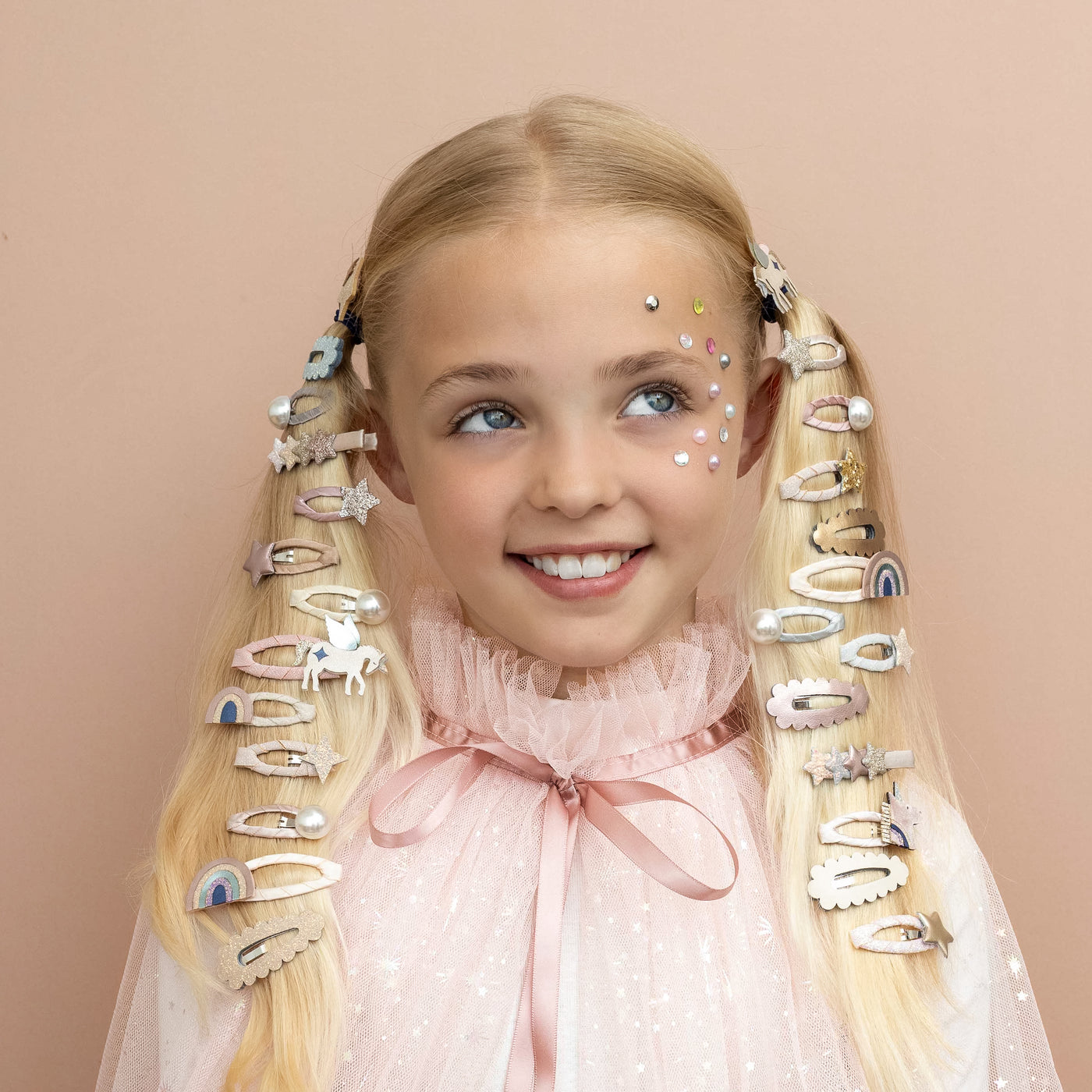 A super sweet unicorn, rainbow and stars come together in the prettiest palette of pastels for a look they'll love!