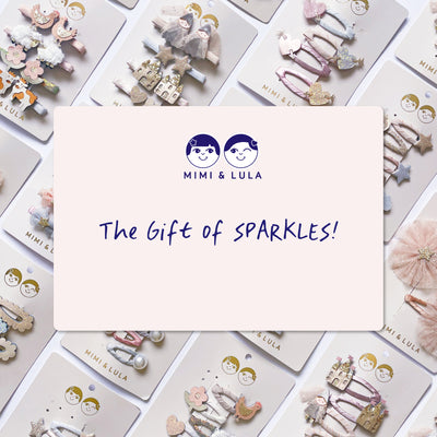 Mimi & Lula hair accessories with a gift card overlay on a white background