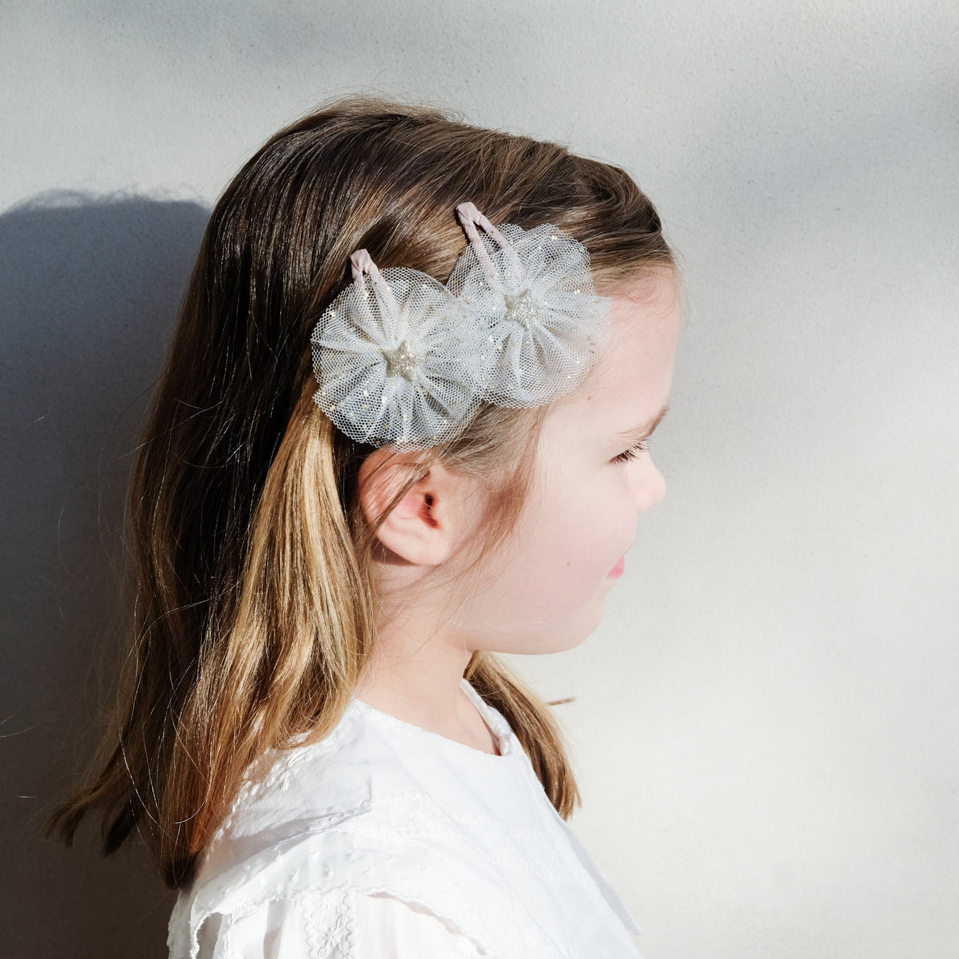 girl wearing ballerina star clic clacs in hair