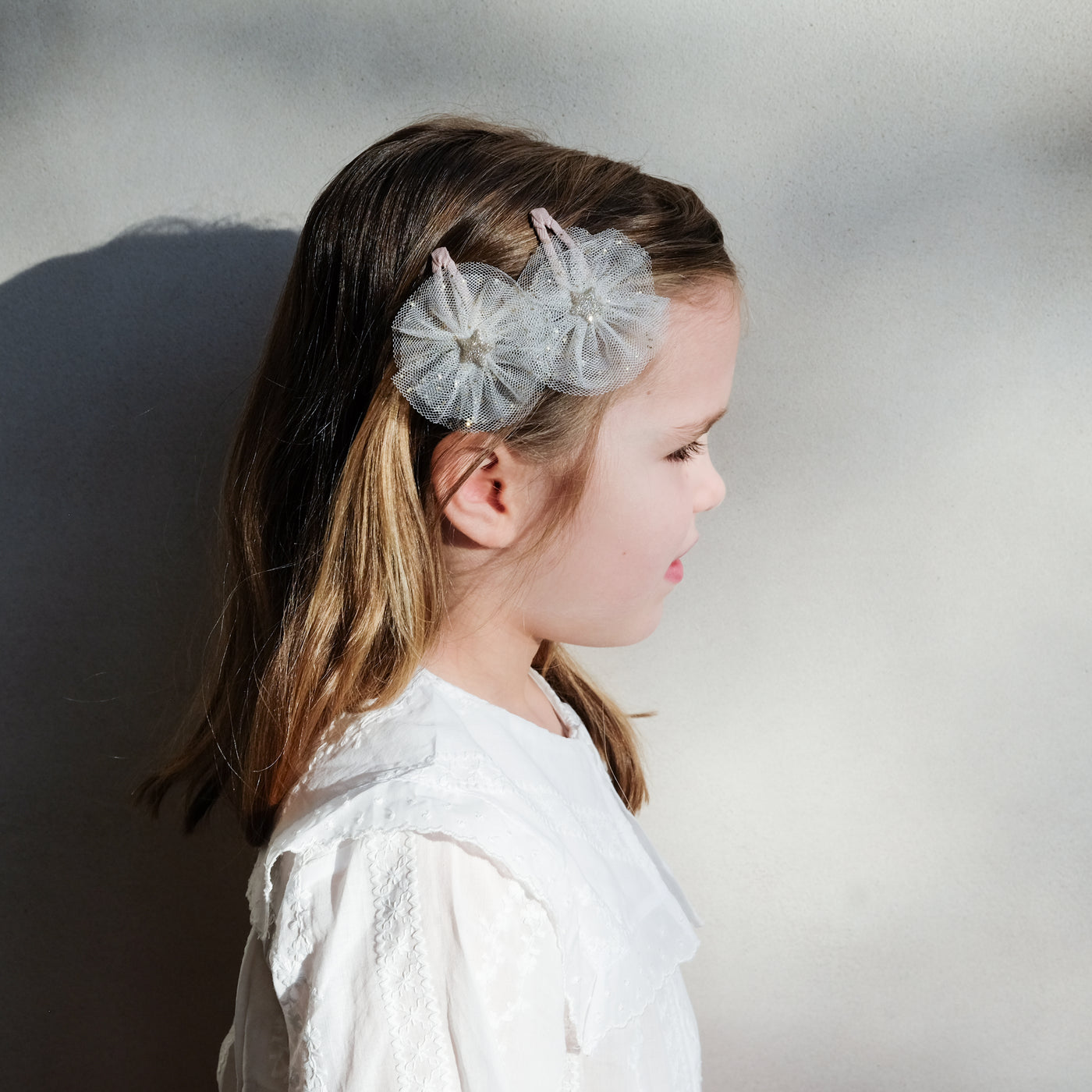 girl wearing ballerina star clic clacs in hair