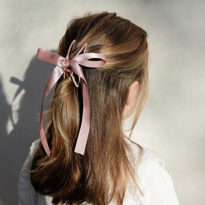 girl wearing ribbon wrapped claw clip in her hair