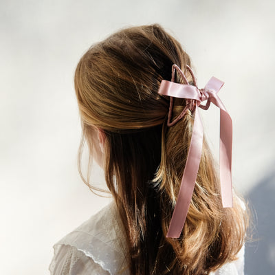 girl wearing ribbon wrapped claw clip in her hair