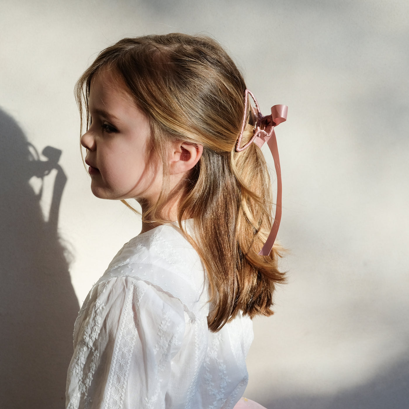 girl wearing ribbon wrapped claw clip in her hair