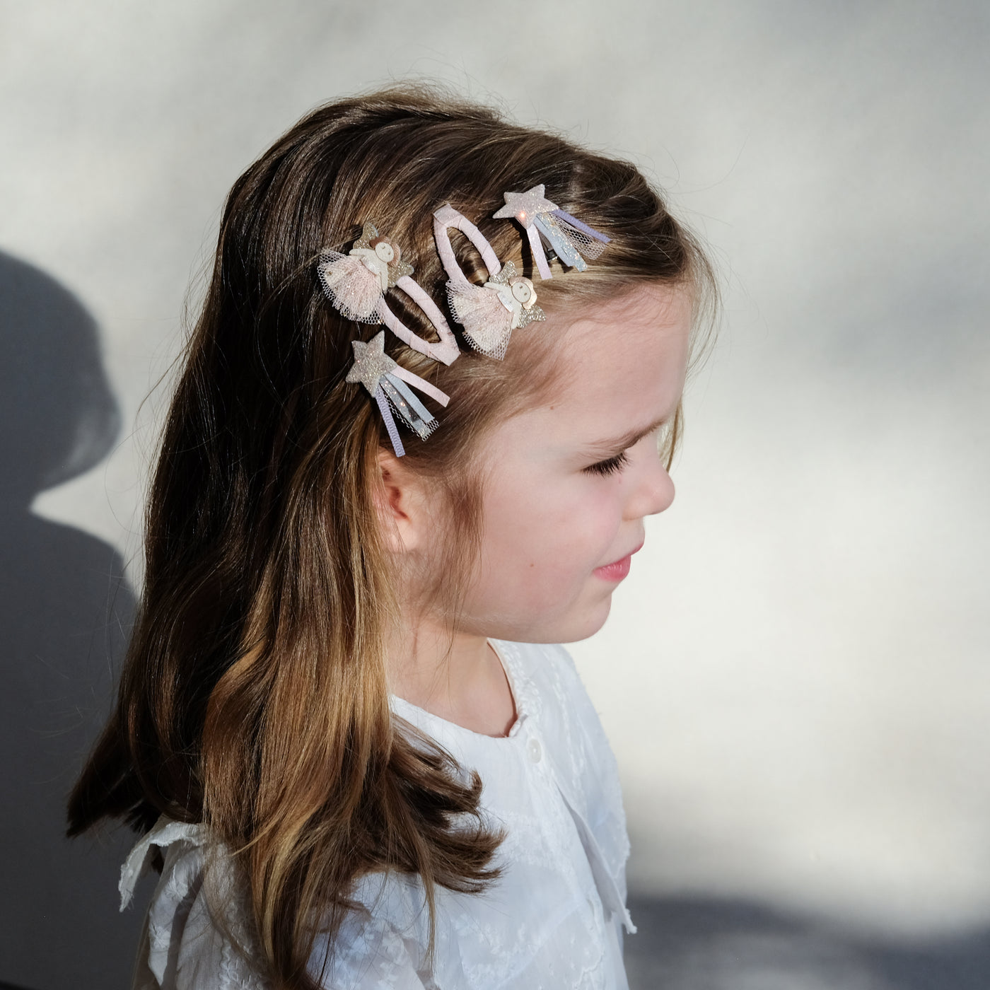 girl wearing fairy clip set in hair