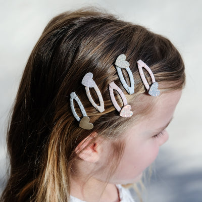 girl wearing teeny heart mini clips in her hair