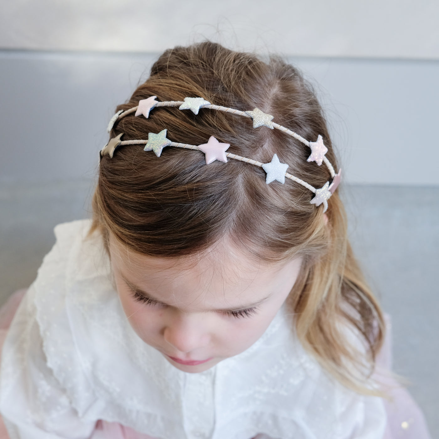 girl wearing stellia star double alice band in her hair