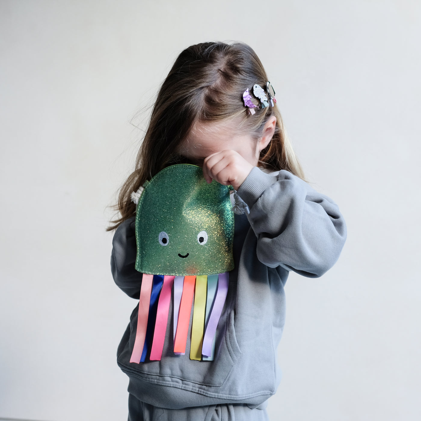 girl looking inside an octopus bag