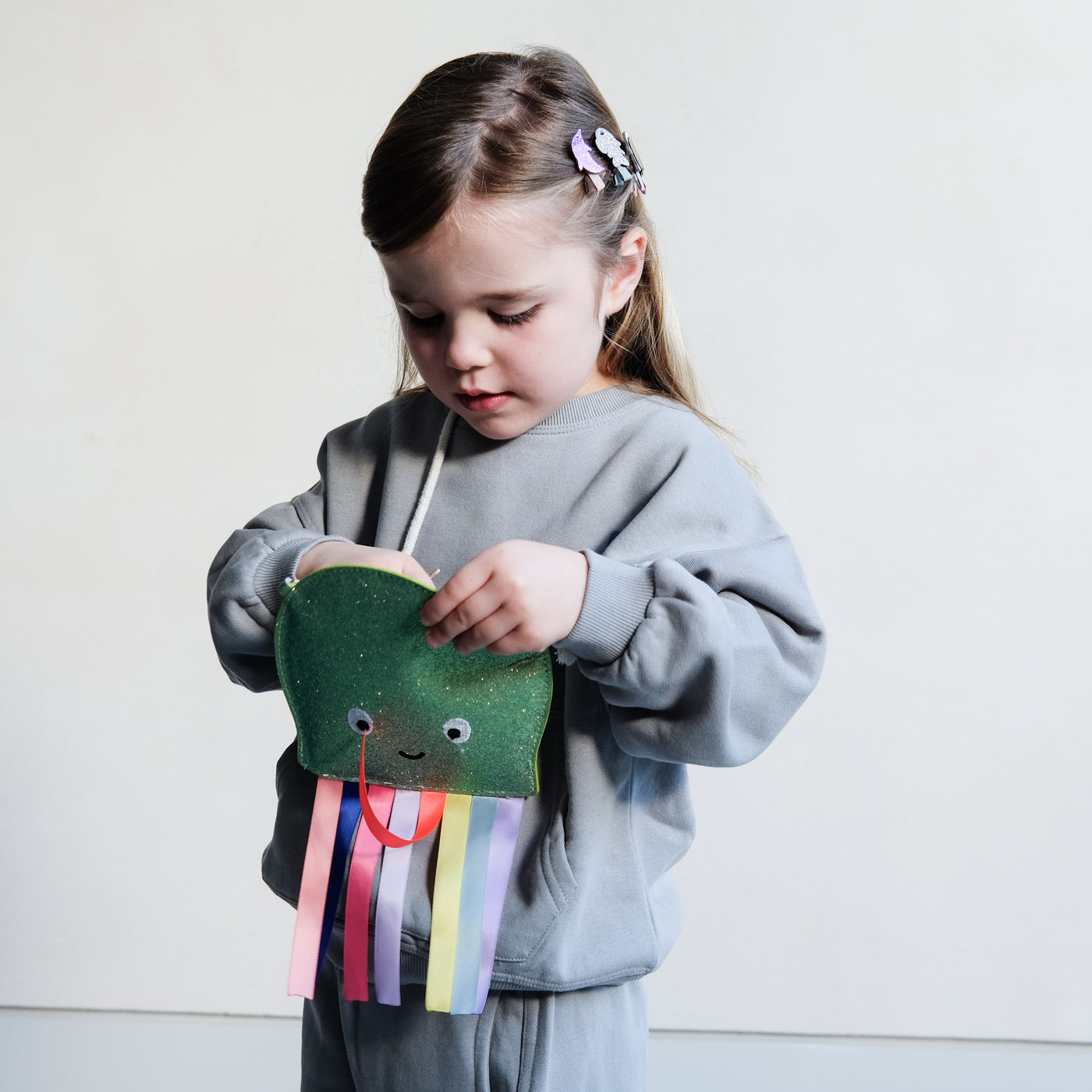 girl holding an octopus novelty bag