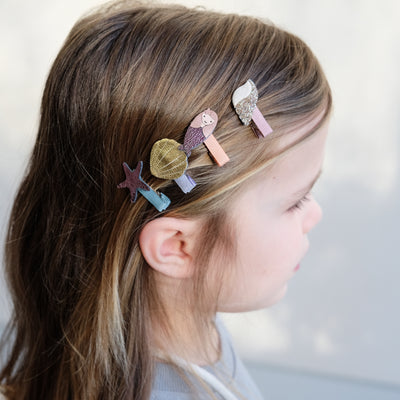 girl wearing mermaid mini clips in her hair