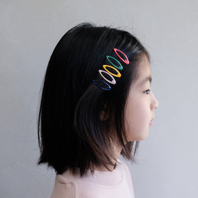 girl wearing colourful mini enamel clic clacs