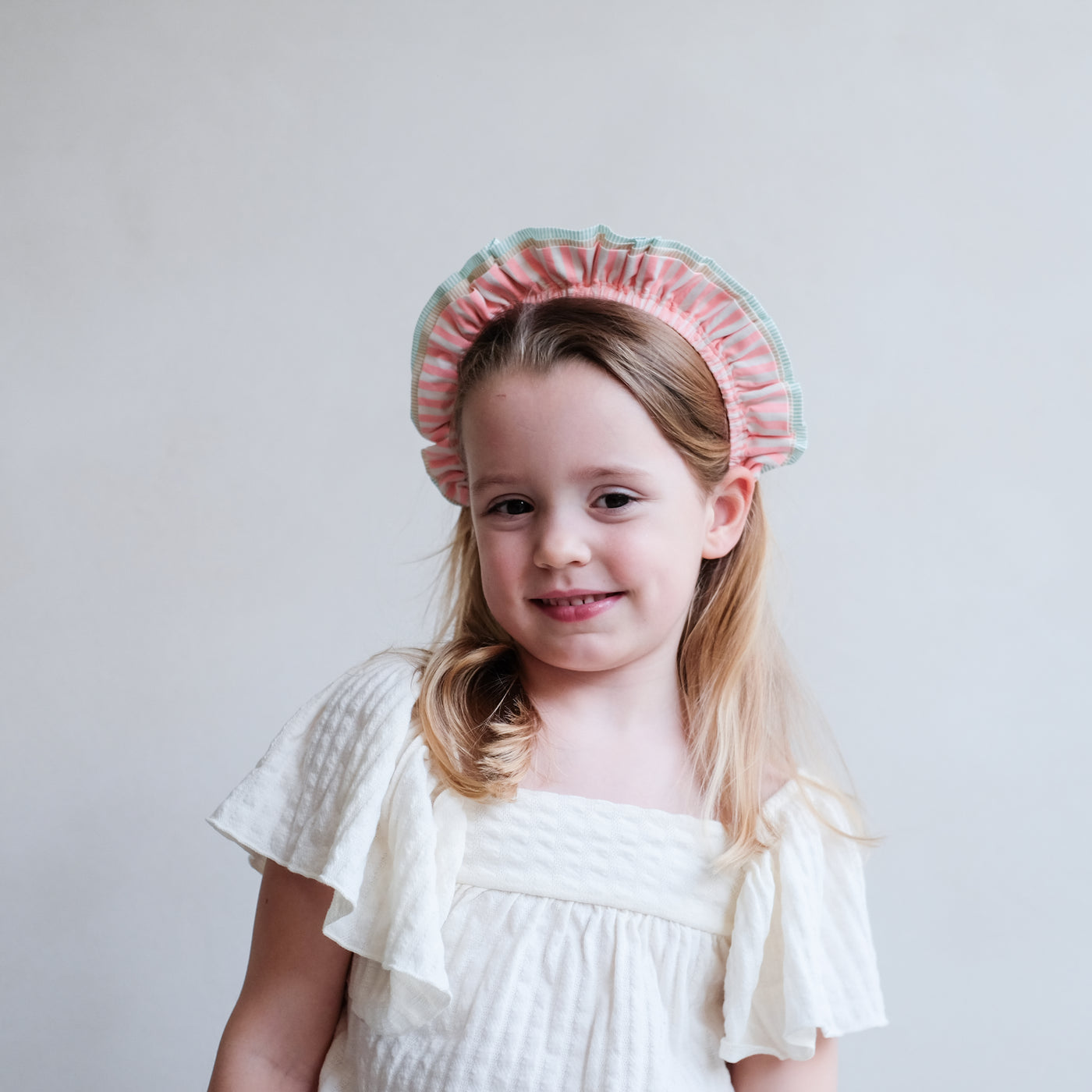 girl wearing stripe ruffle alice