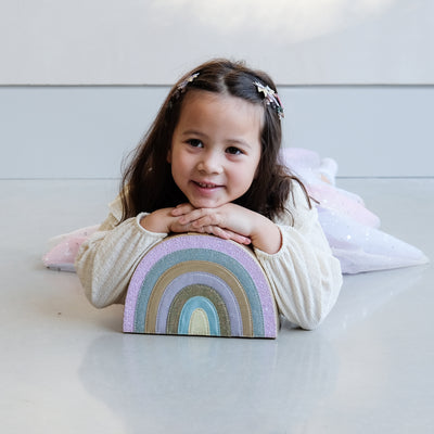 girl holding the rainbow jewellery box