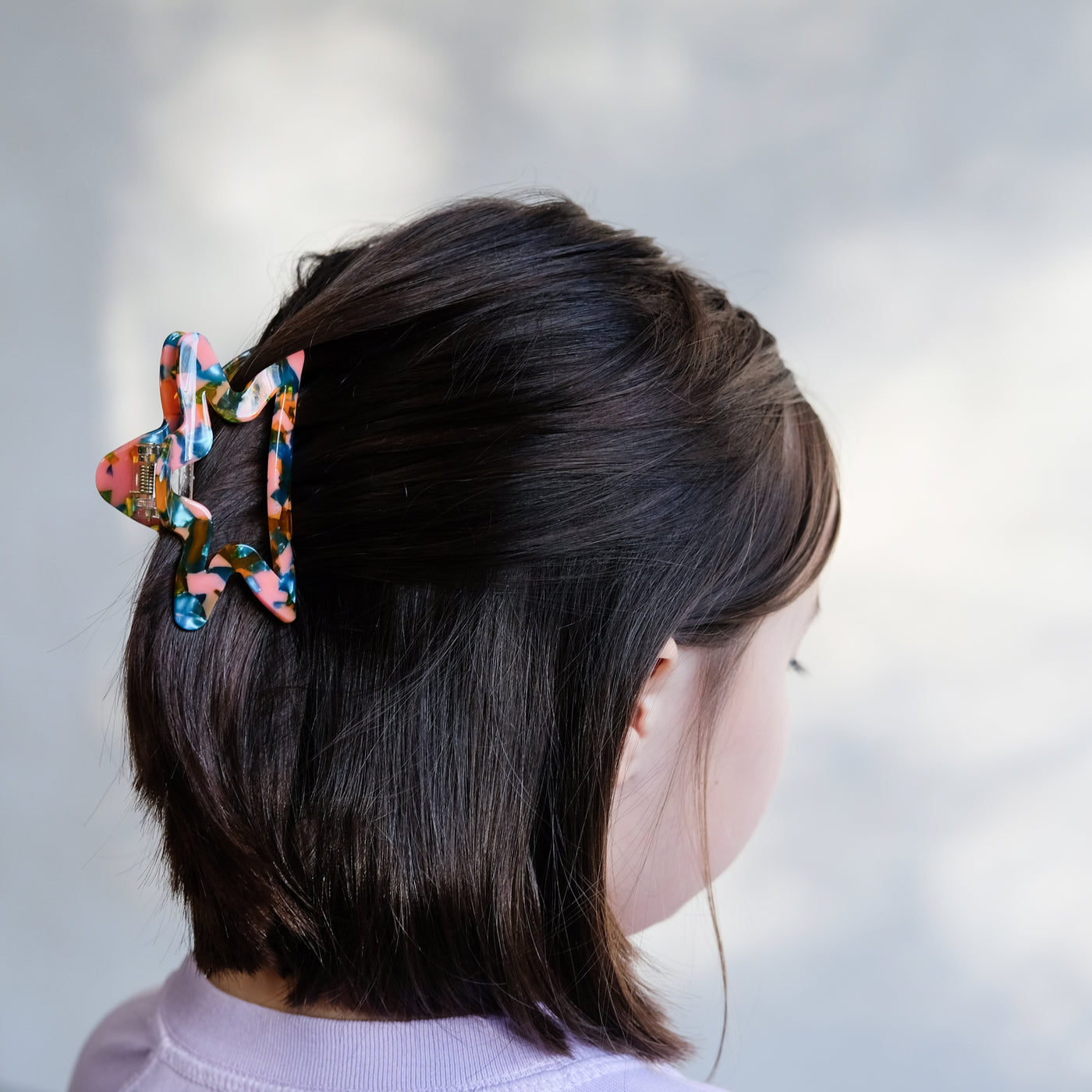 girl with star claw clip in hair