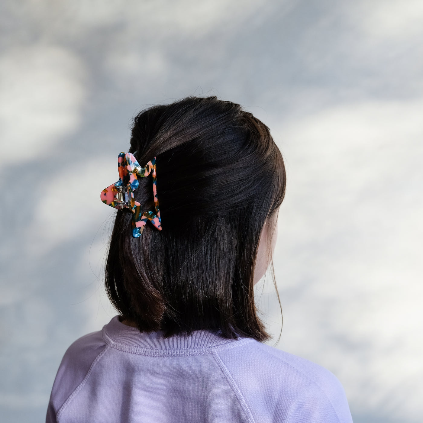 girl with star claw clip in hair