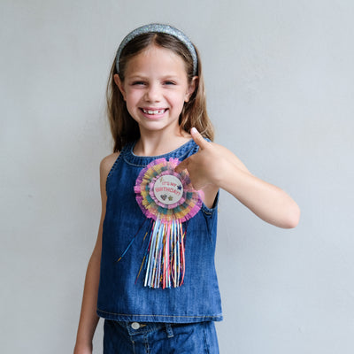 girl wearing diva colourful birthday badge