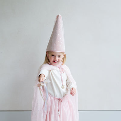 Video of a girl wearing shimmer pink princess cape, crown, tutu, and wand