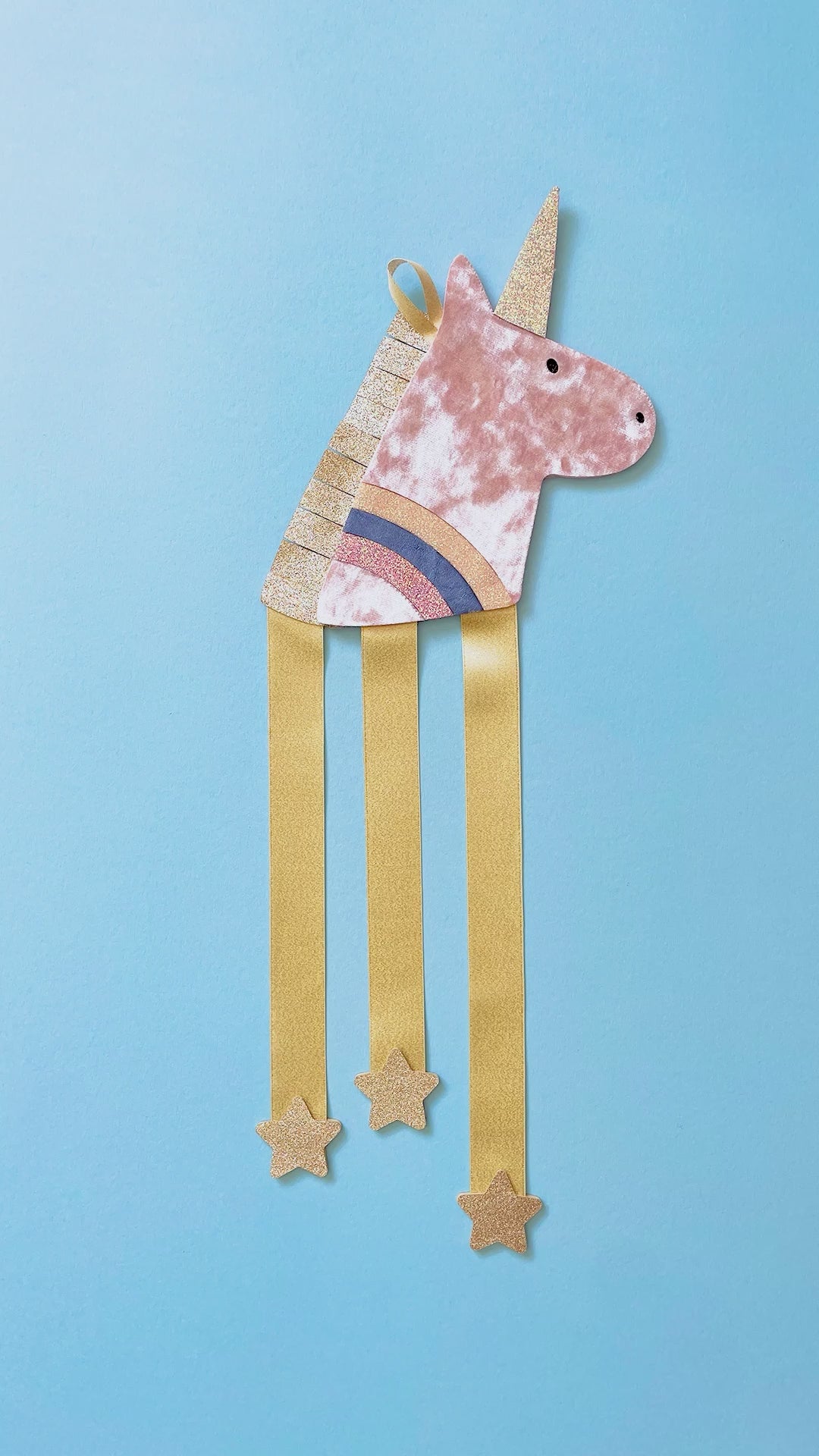 Video of unicorn hair clip hanger getting filled up with clips