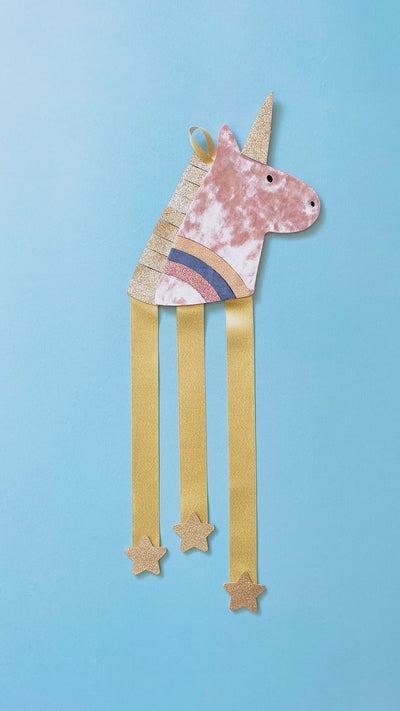 Video of unicorn hair clip hanger getting filled up with clips
